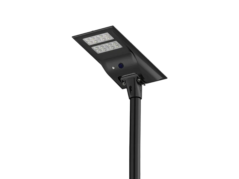 Solar street light with an integrated panel and battery on a pole, photographed against a white background